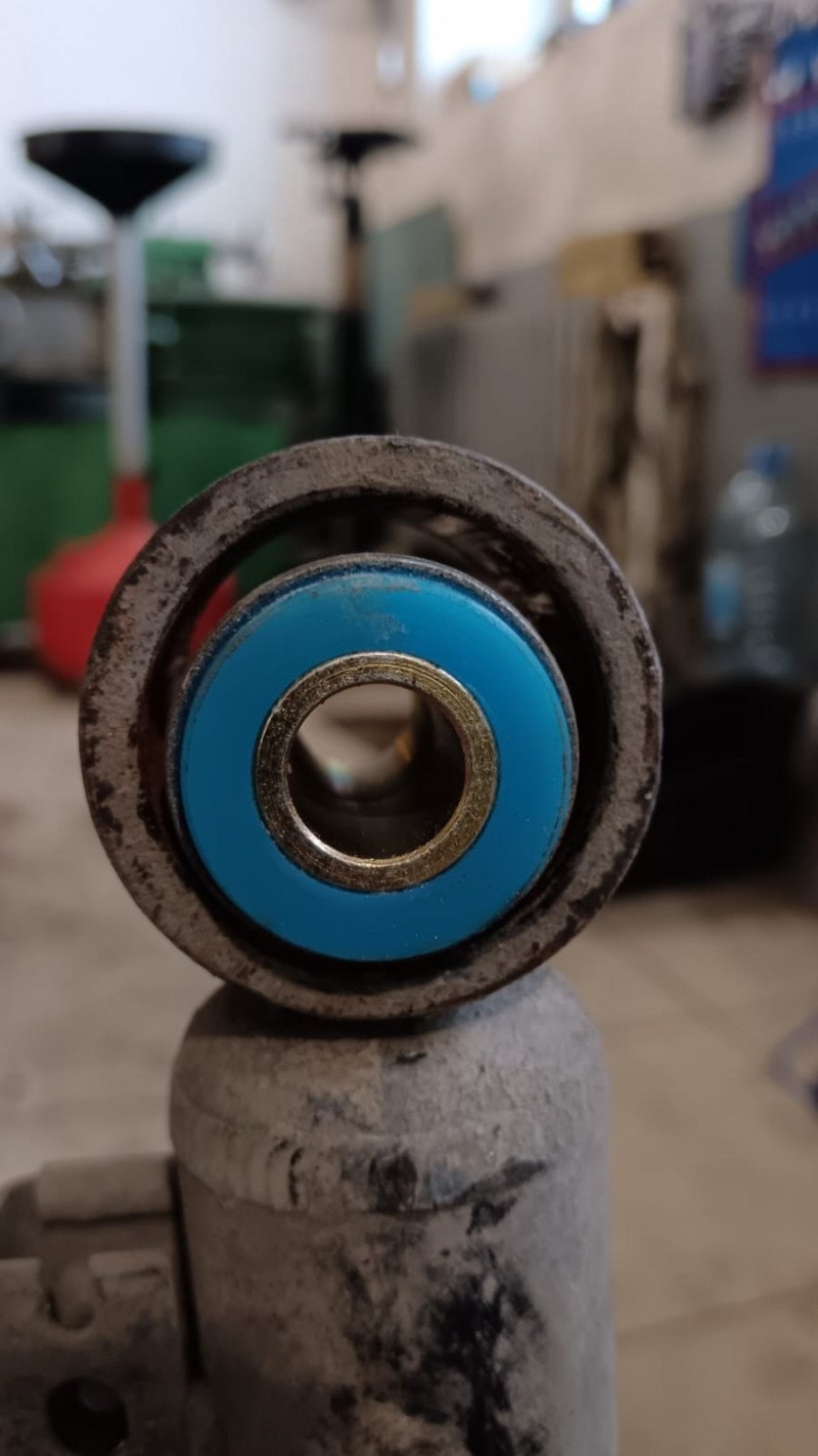 Bushing, front suspension (shock absorber lug, lower) pressed-in. Hardness shore 87A